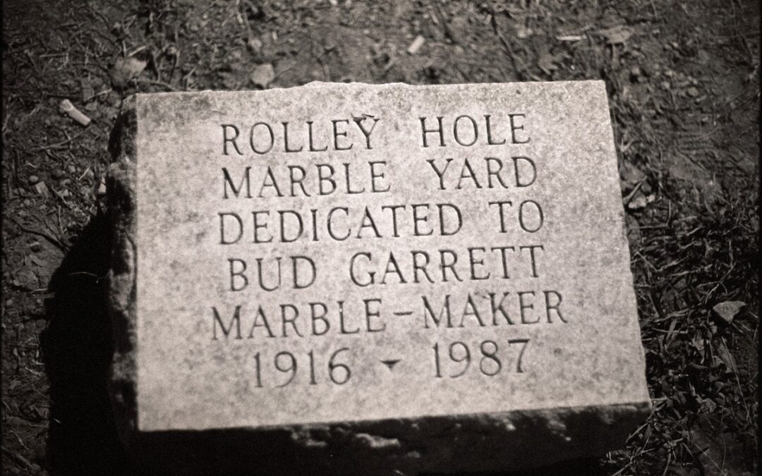 marker for Rolley Hole Marble Yard dedicated to Bud Garrett 1916-1987