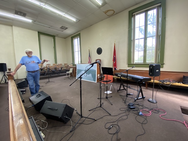 photo of musical performance setting up in courtroom of historic courthouse